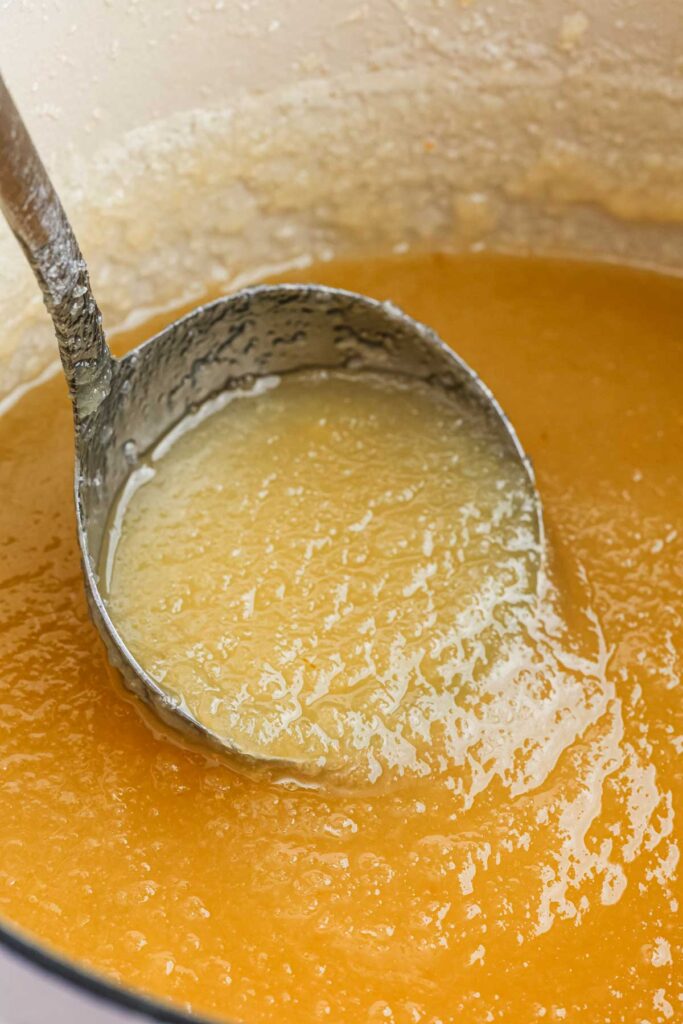 A spoon full of pear honey.