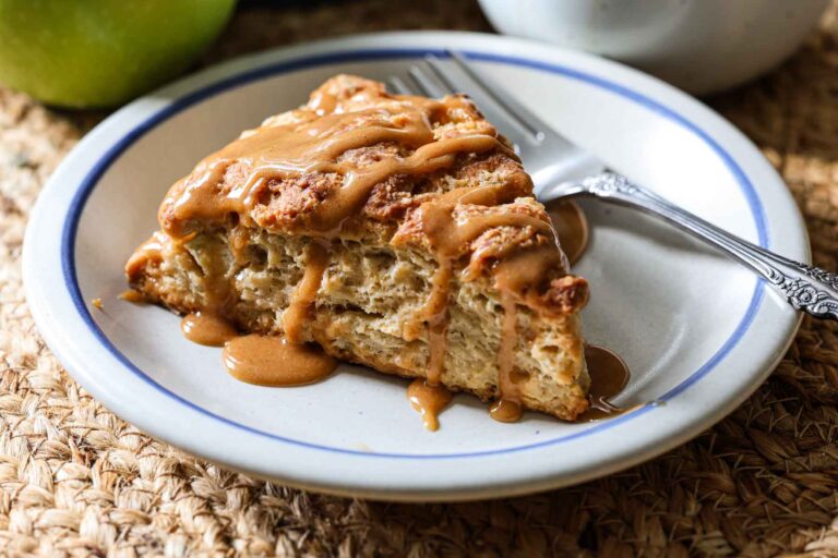 Apple spiced scone with glaze drizzled on top.