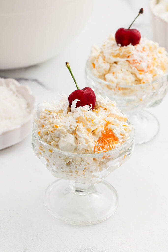 two dishes of Frog Eye Salad with a cherry on top