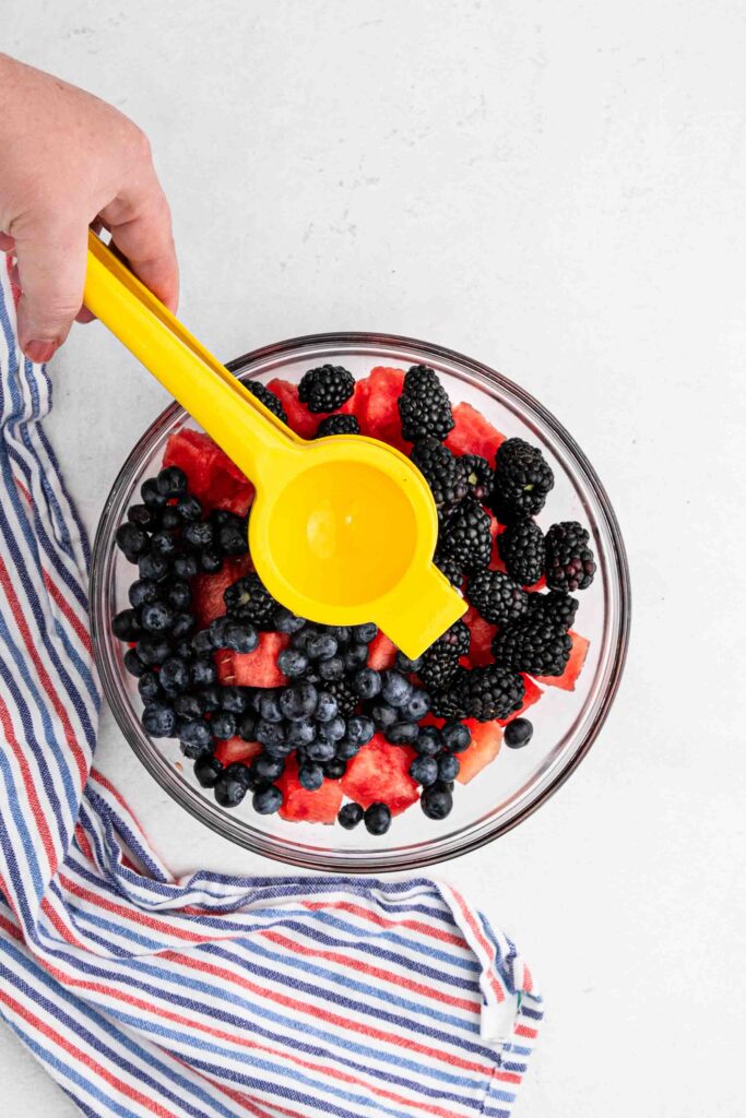 squeeze lemon juice over fruit.