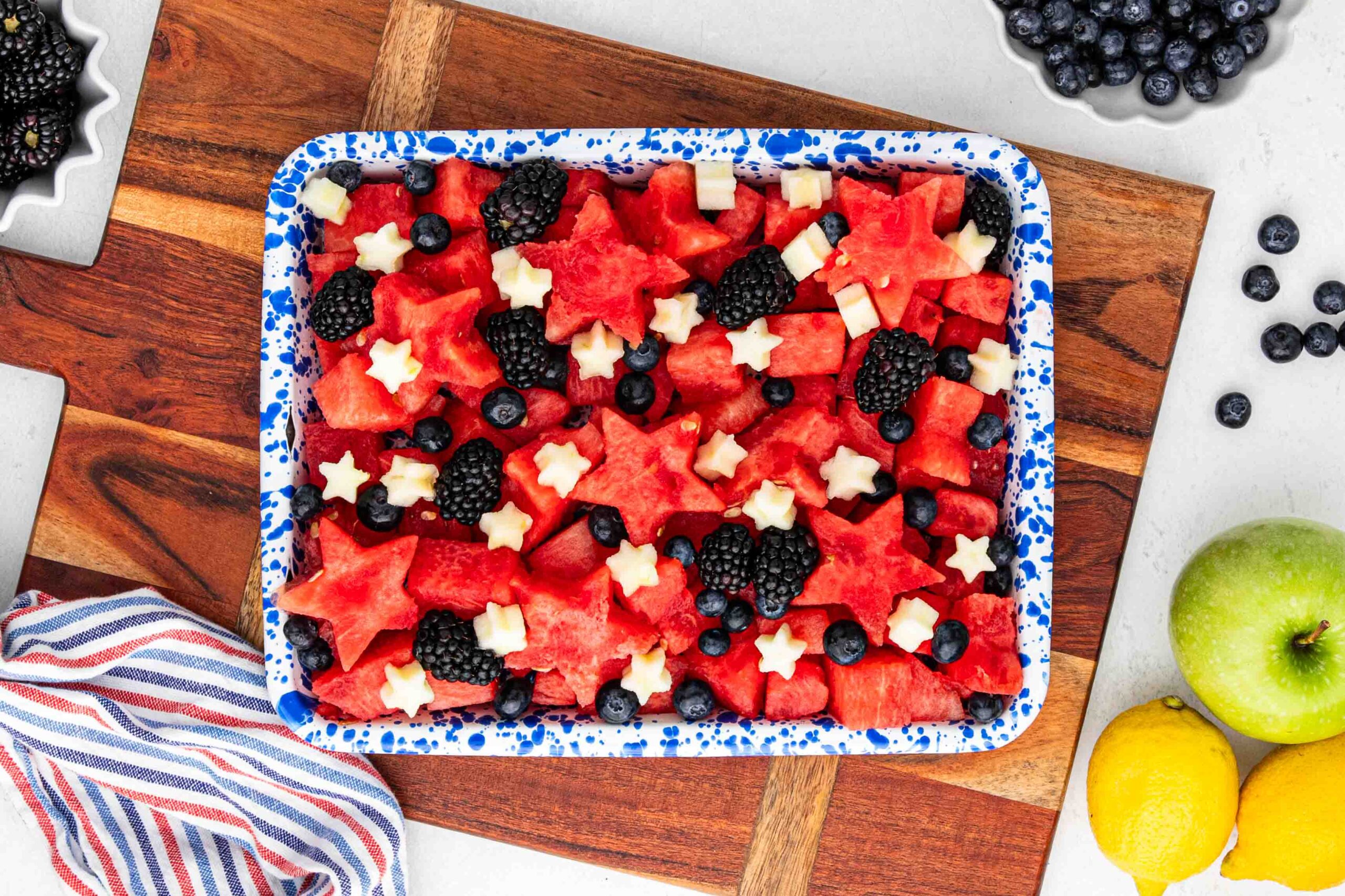 Summer fruit salad overhead image in enamelware pan.