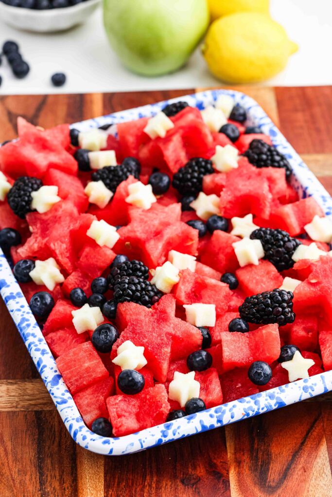 Watermelon and apple stars in blue dish.