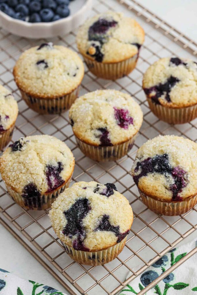 Gluten free blueberry muffins on cooling rack.