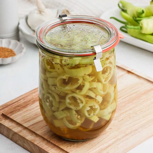 Sealed glass jar of peppers