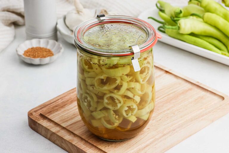 Sealed glass jar of peppers