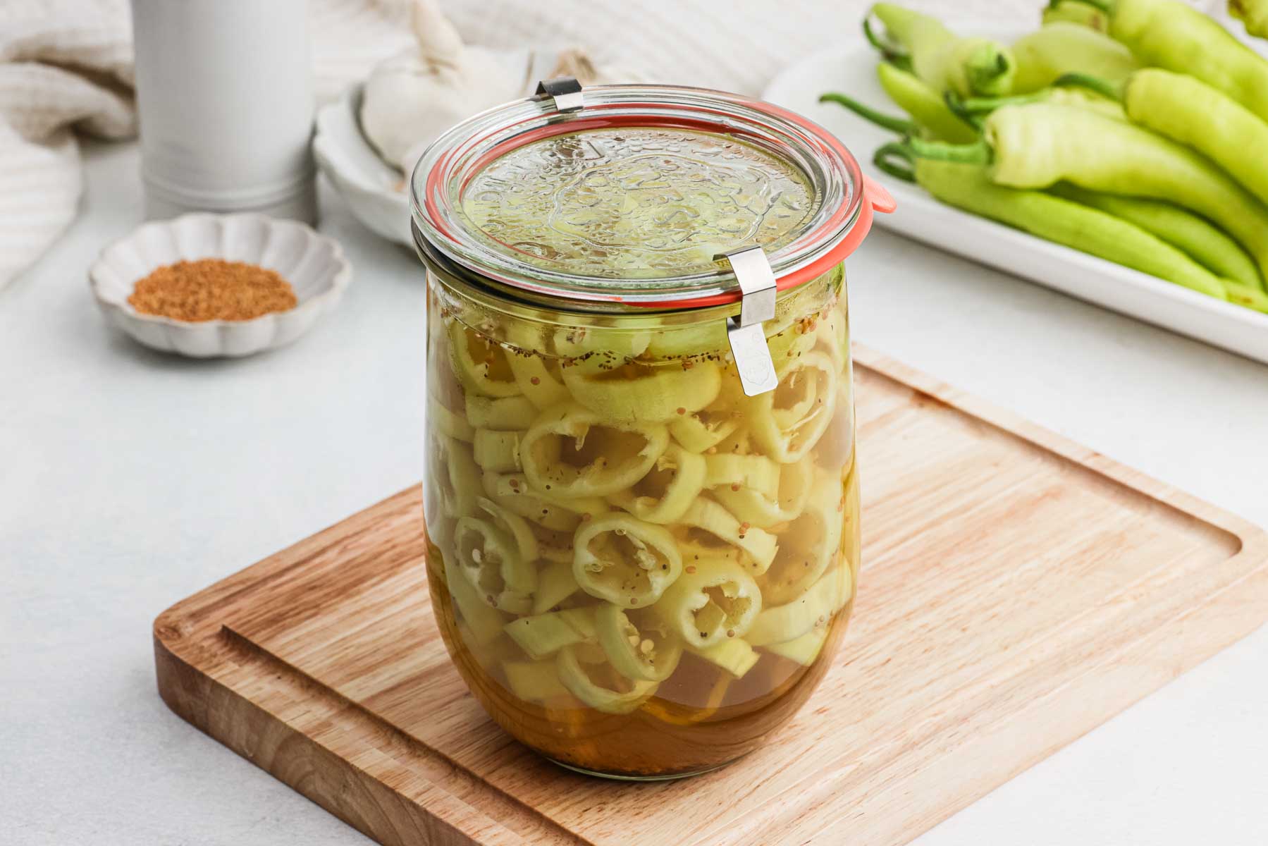 Sealed glass jar of peppers